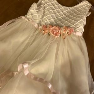 The brand is rare editions white dress with pink flowers and pink satin trim